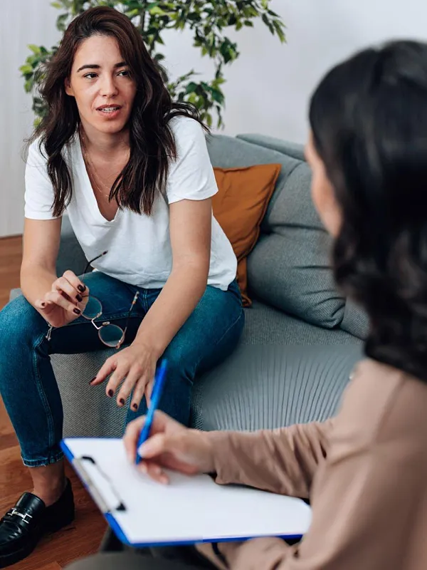 Young person reflecting in a therapy setting